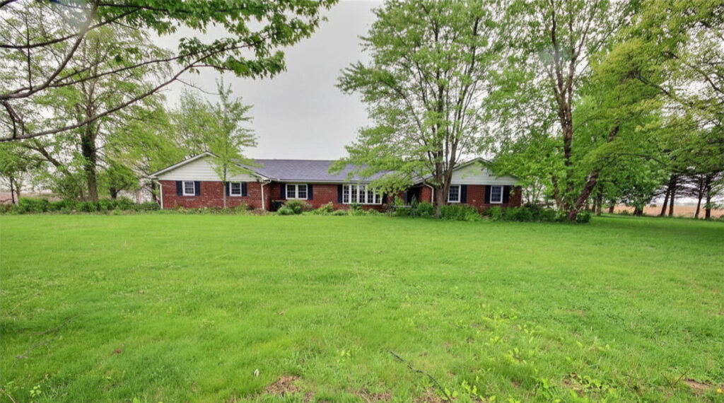 Peaceful Country Living in this 5 Bedroom Ranch on 1 Acre with four season room and Heated Garage